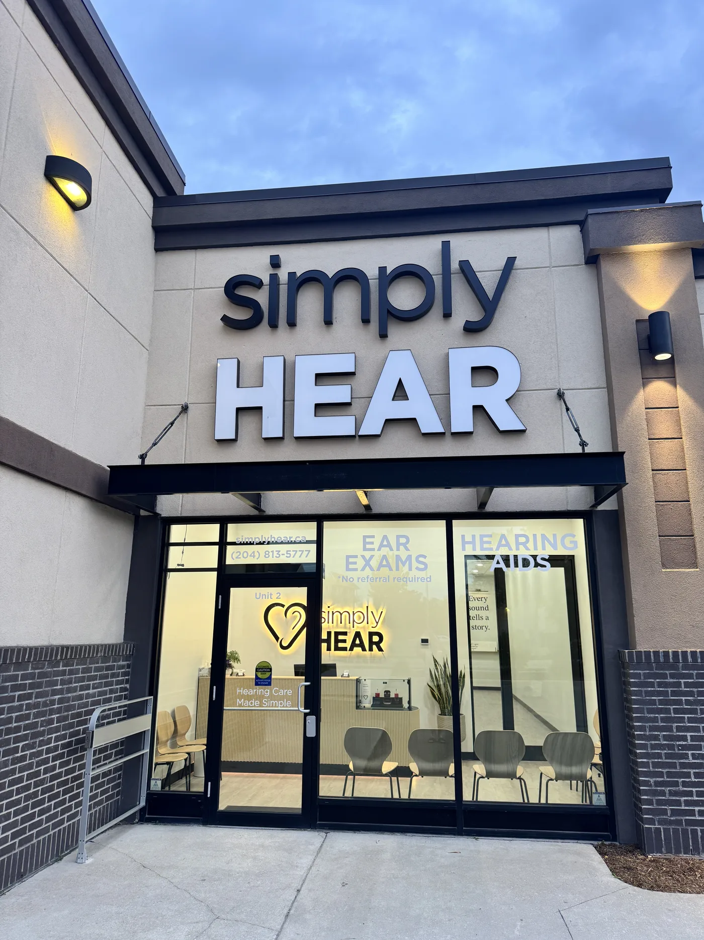 The simplyHEAR hearing clinic storefront at 980 St Anne's Rd in Winnipeg — signage for ear exams and hearing aids, Hearing Care Made Simple